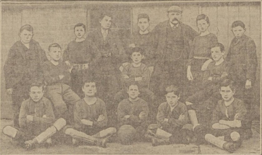 Herbert Craik, back row, standing number 2 from right next to the older gentleman.