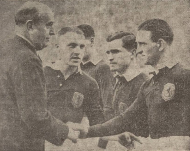 The guest of honour at Hampden meets the Scottish team. Czechosloak Minister of Foreign Affairs, Jan Masaryk, shakes hands with Dougie Wallace. Skipper Shankly does the introducing. Alec enters is also in the picture.